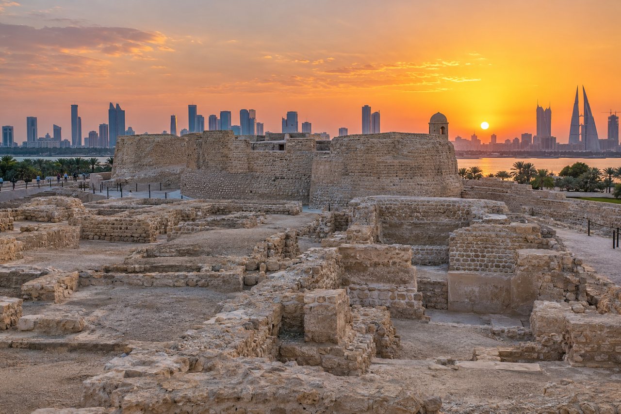 Manama: the ruins of Qal'at al-Bahrain fort at sunset with the skyline (AI-generated image)
