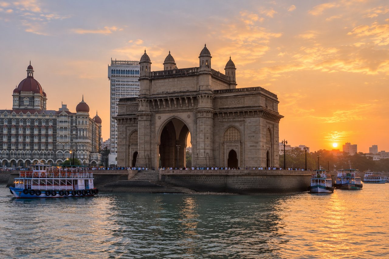 Mumbai: the Gateway of India by the harbour at sunset (AI-generated image)