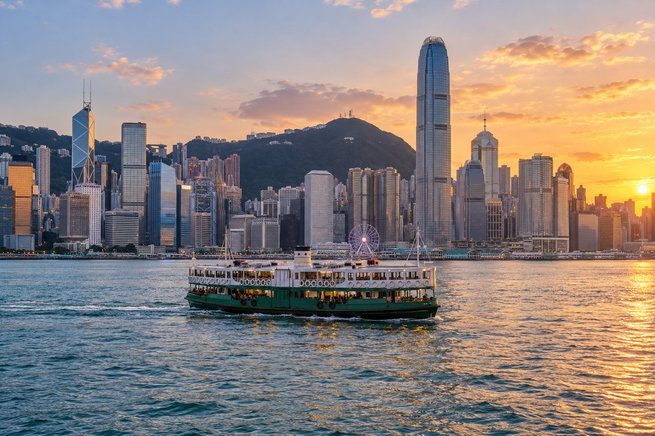 Hong Kong: Victoria Harbour skyline at dusk with a green-and-white Star Ferry crossing (AI-generated image)